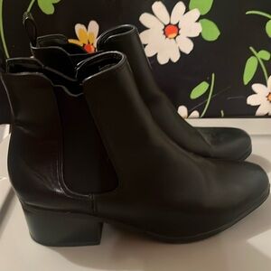 Women’s black leather boots.
